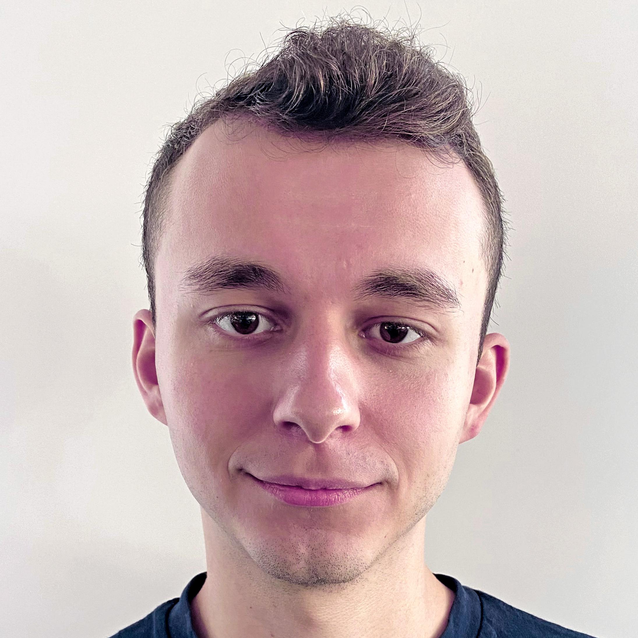 A suggestive pose in a dimly lit setting