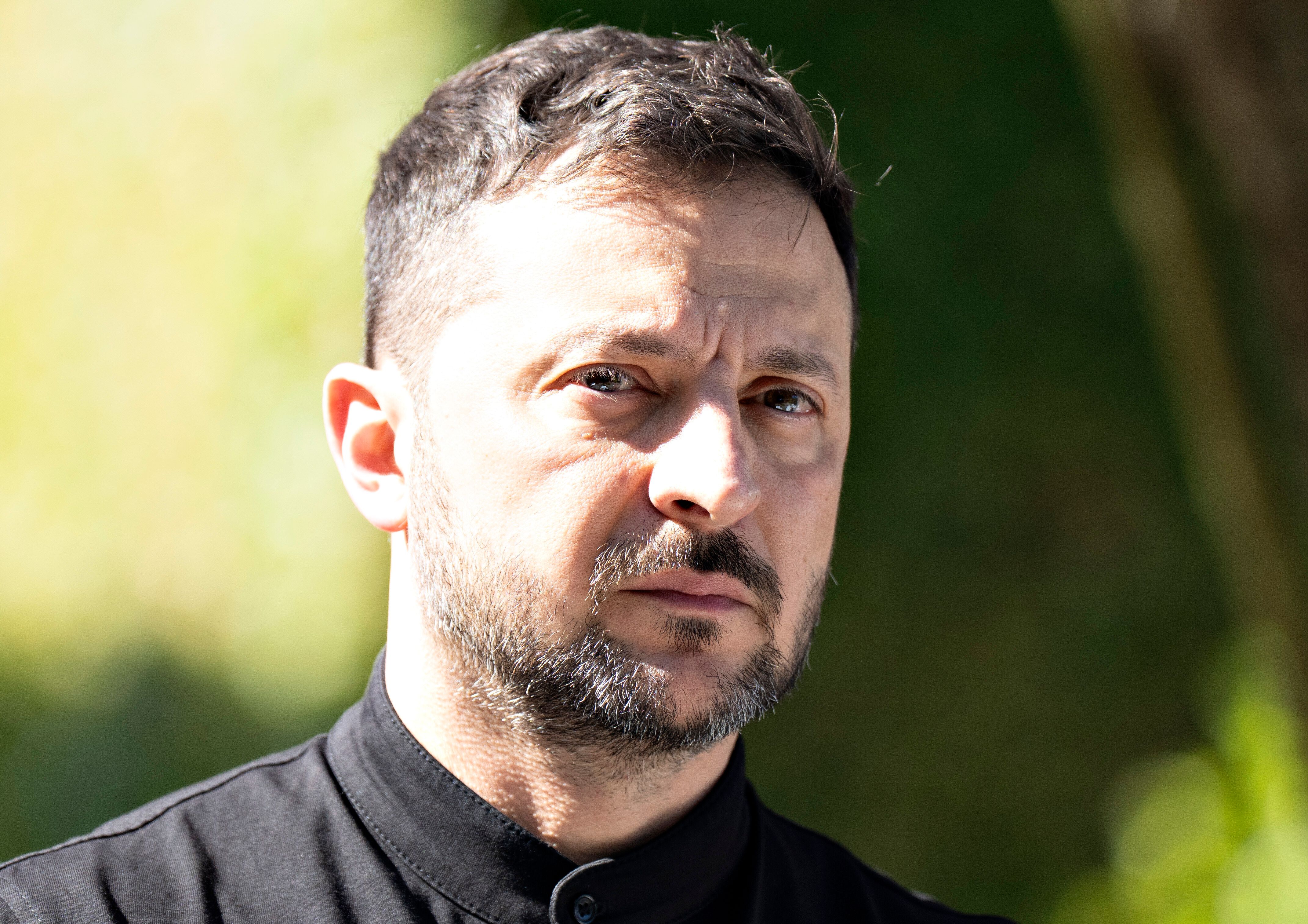 A shadowy figure against a vibrant backdrop